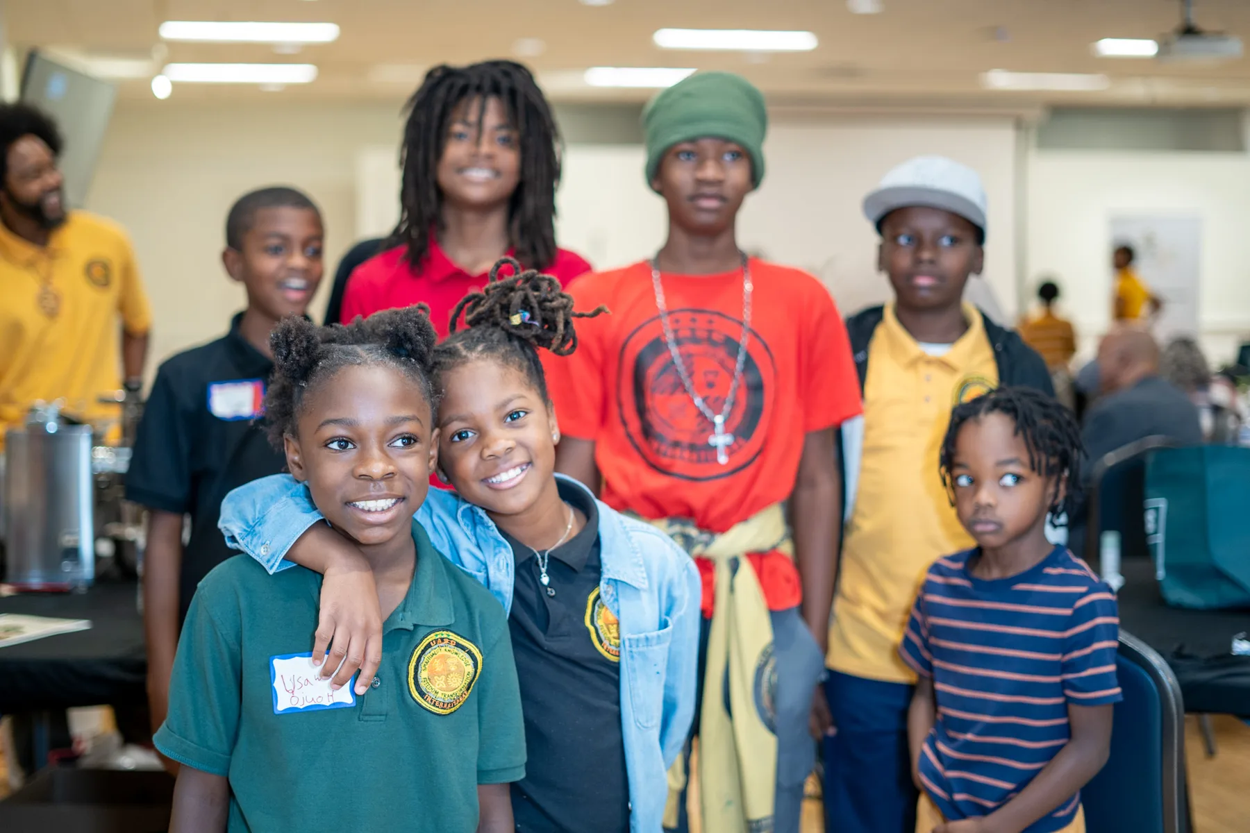 A group of young people gather together at a community event.